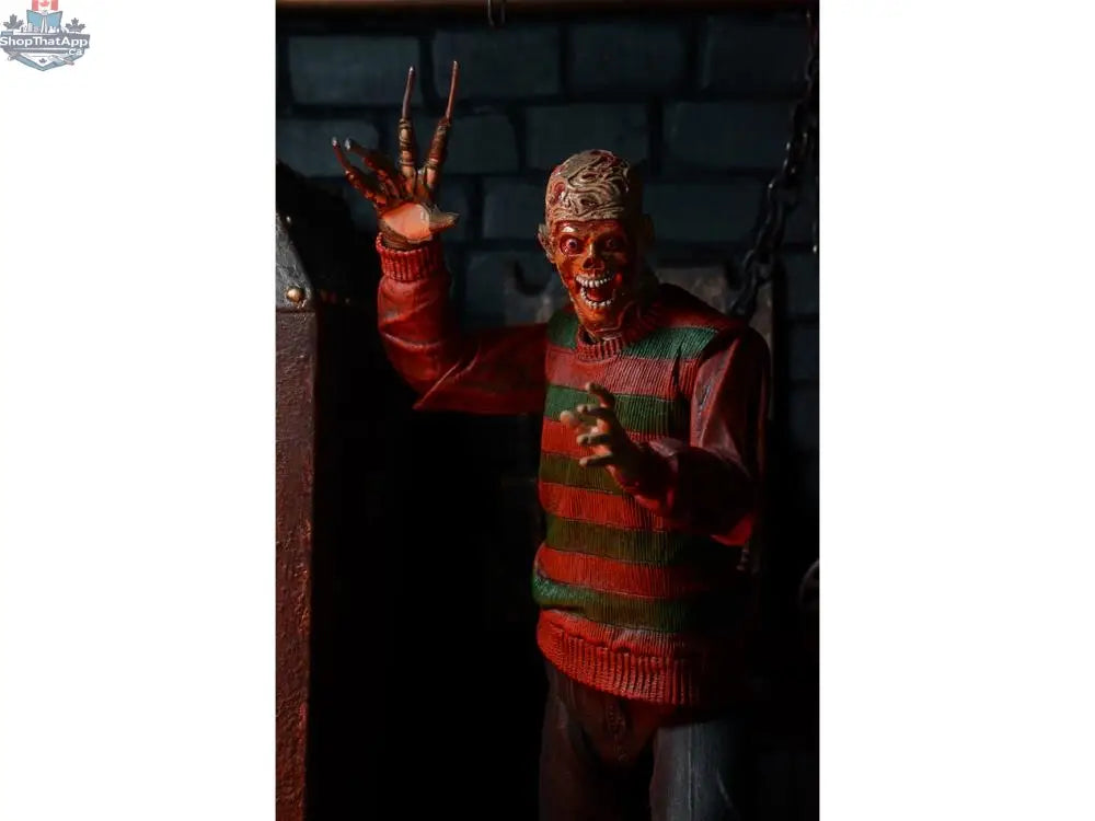 Toy Snowman Nightmare on Elm Street Freddy Krueger action figure, collectible toy with detailed costume and iconic blade glove.