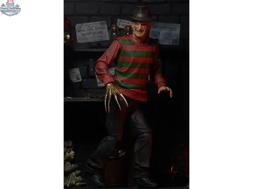 Toy Snowman Freddy Krueger action figure from A Nightmare On Elm Street, detailed collectible toy with iconic costume and blade glove.