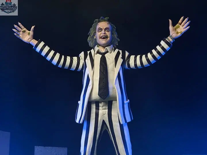 Beetlejuice action figure in black and white suit, collectible toy from Toy Snowman, detailed figure with spooky costume features.