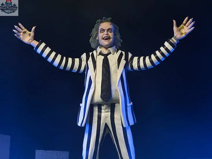 Beetlejuice action figure in black and white suit, collectible toy from Toy Snowman, detailed figure with spooky costume features.