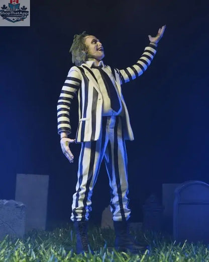 Beetlejuice action figure in black and white suit, Toy Snowman collectible toy, detailed figure with spooky character features.