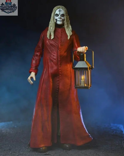 Toy Snowman Otis action figure in red robe, 20th anniversary collectible from House of 1000 Corpses, detailed toy collectible.