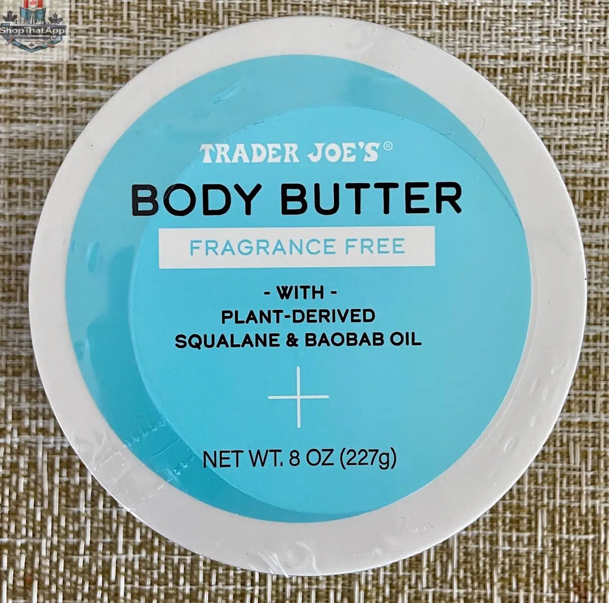 Trader Joe's fragrance-free body butter from Vancou-Vert Trading Ltd., 227g jar with smooth, creamy texture.