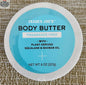 Trader Joe's fragrance-free body butter from Vancou-Vert Trading Ltd., 227g jar with smooth, creamy texture.
