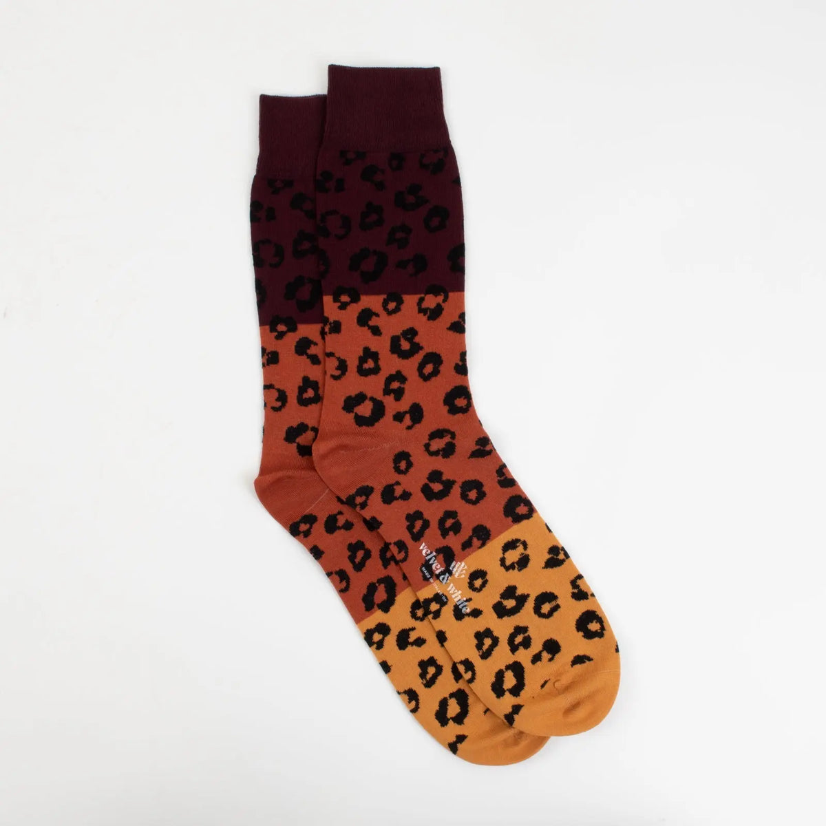 Leopard print socks by Velvet and White featuring stylish nighttime design, perfect for chic evening wear.