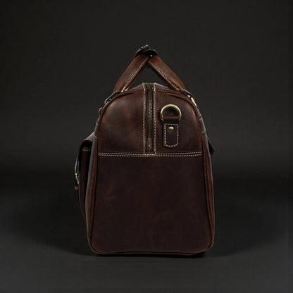 Brown distressed leather Voyager Duffle bag by NAB Leather, full-grain leather handbag with sturdy handles and spacious interior.