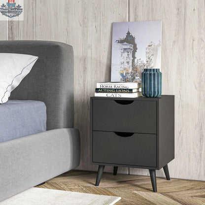 Black Jesse nightstand with drawers and pine wood legs from SLOTH Nation, showcasing a sleek bedroom furniture storage solution.