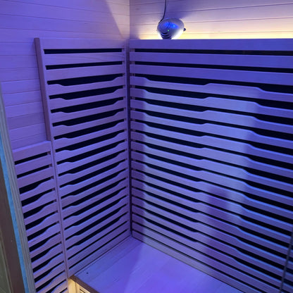 Zoppinh Blisspod Helsinki indoor sauna with two-person capacity, featuring full spectrum lighting and red light therapy panels inside.